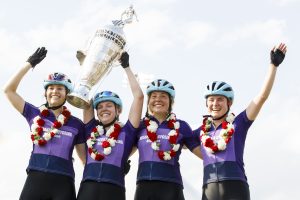 Riders celebrate with the Little 500 Borg-Warner Trophy after winning the Women's Little 500.