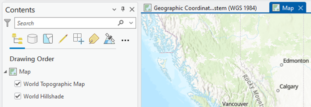 Screenshot of a GIS (Geographic Information System) interface. The left pane titled "Contents" shows a drawing order list with two checked layers: "World Topographic Map" and "World Hillshade." Above the pane are map manipulation tool icons. The main map area displays western Canada, highlighting cities such as Vancouver, Calgary, and Edmonton. The top bar indicates the coordinate system in use: "Geographic Coordinate System (WGS 1984).