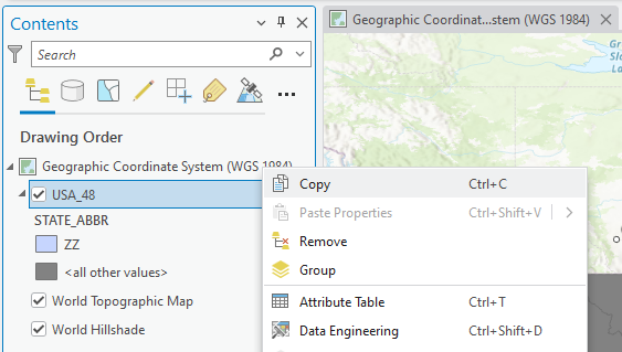 Screenshot of a GIS software interface. The left "Contents" pane lists map layers including "Geographic Coordinate System (WGS 1984)," "USA_48," and "STATE_ABBR." A context menu is open for the "USA_48" layer, showing options like Copy, Paste Properties, Remove, Group, Attribute Table, and Data Engineering. A partial map with geographic features is visible in the background.