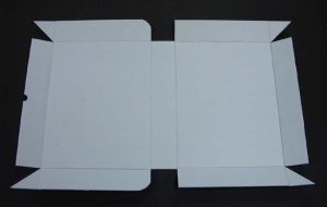 Piece of corrugated board with creases