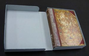 Corrugated clamshell box, open, with book inside