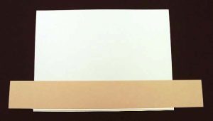 Preparing to glue the edges of the endsheets