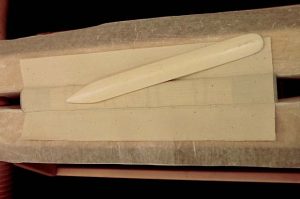 Gluing the super to the text block spine