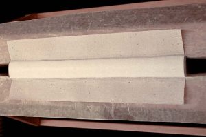 Adhering the spine lining paper