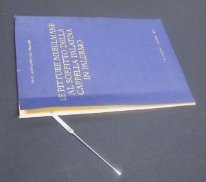 Lifting the cover cloth from the board at the spine edge