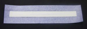 Spine inlay affixed to the new spine cloth