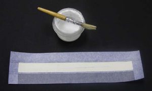 New spine piece with shaded area indicating where glue is to be applied