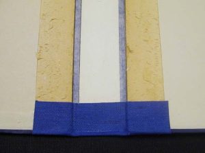 Close up of one of the turn ins after it has been glued down