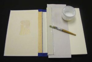 Gluing the hinge cloth