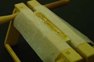 Removing spine lining with a poultice
