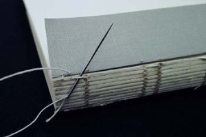 Stitching at one end of the endsheet