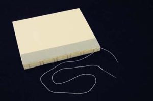 Thread remaining to sew the endsheet on