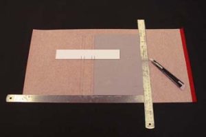 Transferring spine measurements from paper strip to the book cloth