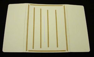 Double-sided tape affixed to the inner side of the outer board