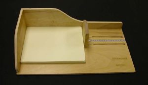 Measuring the wrapper to get the measurements for the cover boards