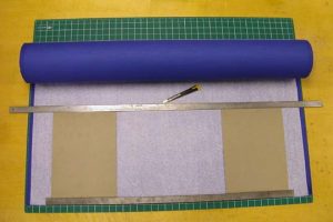 Cutting cloth off the roll