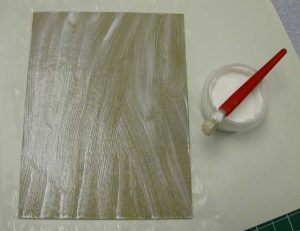 Gluing up the boards to attach to the cloth
