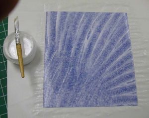 Gluing up the cloth for the inside of the cover
