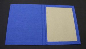 Inside cover cloth positioned and affixed