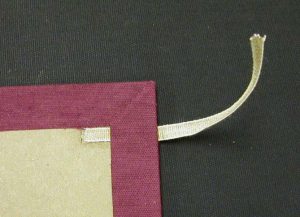 Turning in the cloth after ties placed