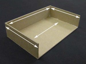 Clamshell trays with lines indicating grain direction of each part