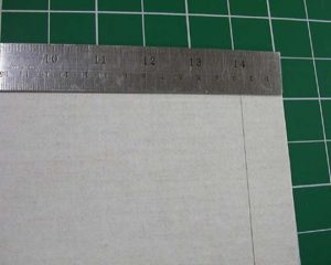 Marking and cutting the piece of cloth to cover the sides and front wall of the A tray