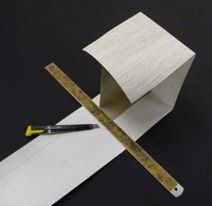Trimming the cloth of the A tray with 1" left