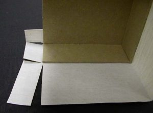 Recessed cuts at the corners of the A tray