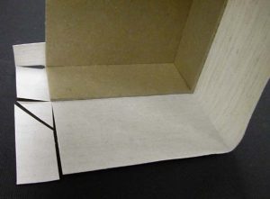 Center tab of cloth trimmed at 45 degree angle