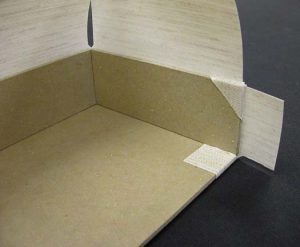 Triangular flap glued down on A tray