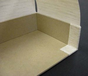 Cloth flap at back end of A tray glued down
