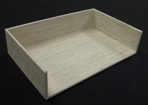 A tray completed with bottom inside cloth glued down