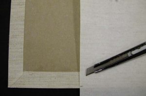 Cutting the length of the cloth for the inside spine area of the box cover