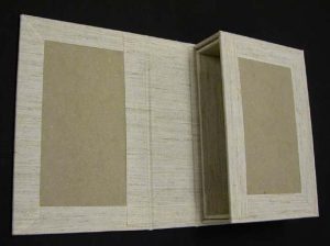 A and B trays nested and in position on the inside of the box cover