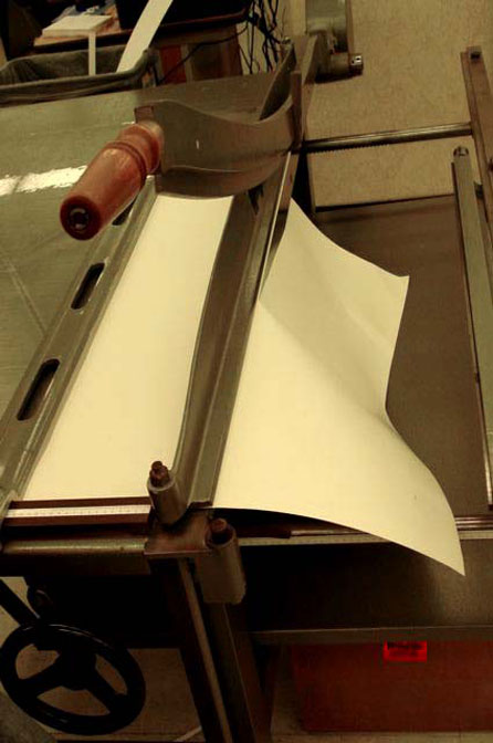 Making the first cut of the folder stock for the Kyle Wrapper on the board shear