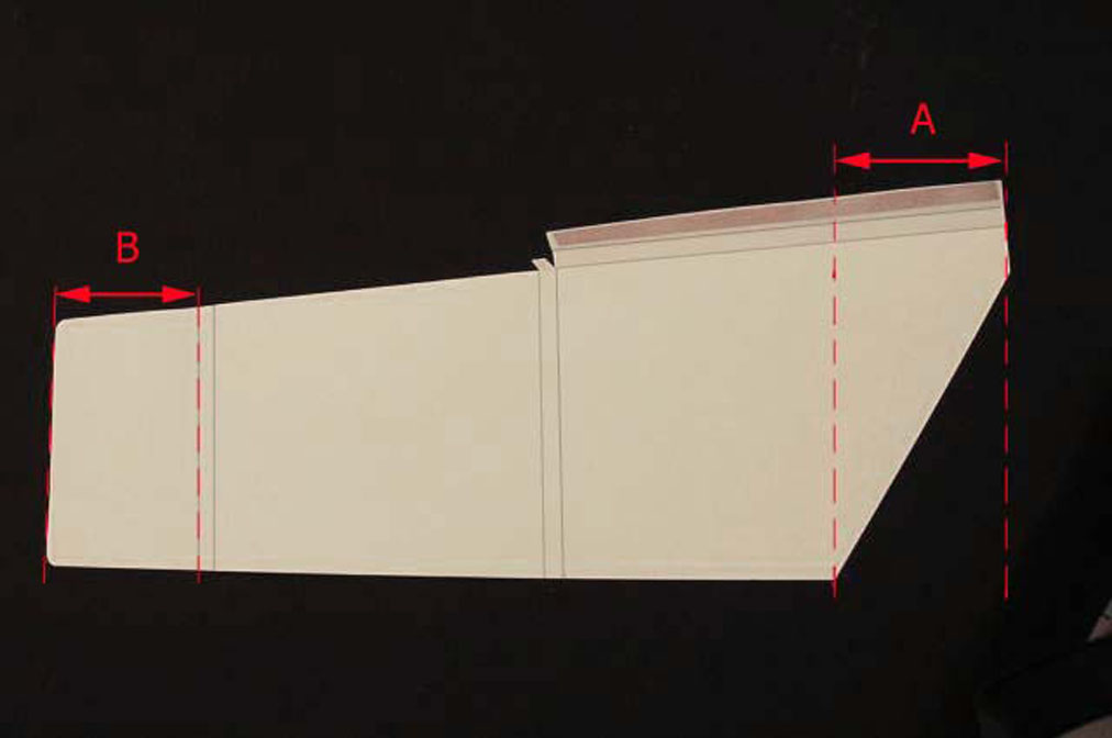 Cut piece of folder stock for the Kyle Wrapper with corners rounded and with double sided tape applied on the seam