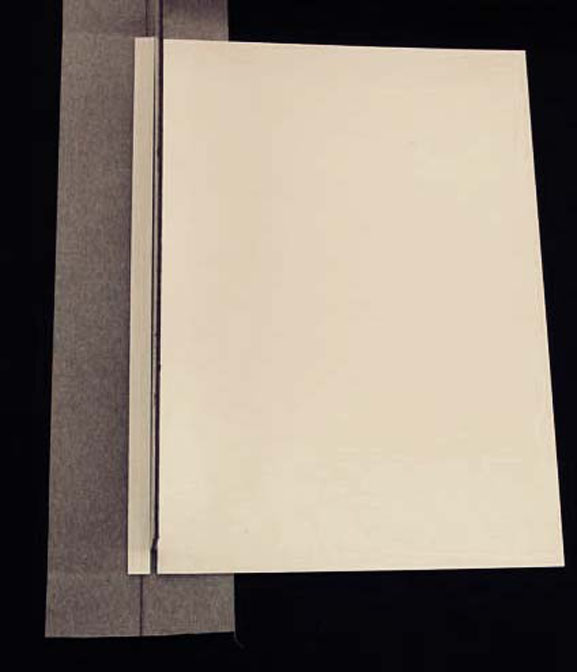 Gluing the pieces of the cove to the bookcloth strip for the Kyle Wrapper cover