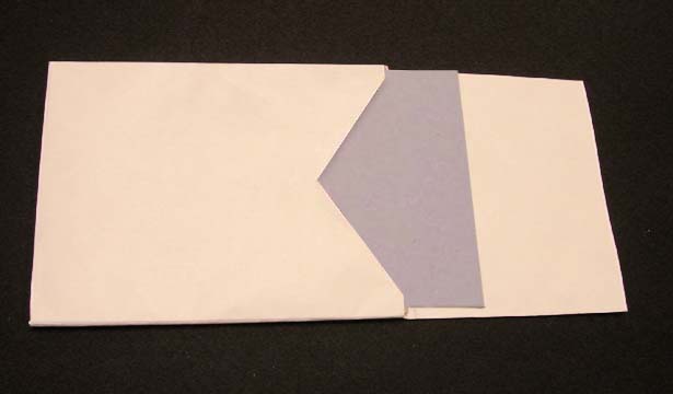 Pocket with a piece of scrap board inserted so the top edge of the pocket can be shaped
