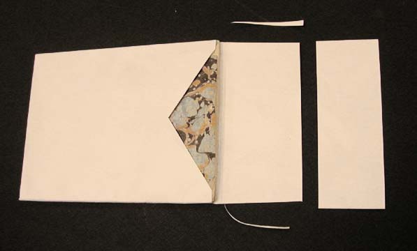 Trimming the flaps of the pocket at a slight angle