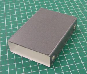 Board with rivets in place folded up