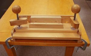 Double-fan adhesive binding press