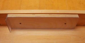 Close up of the jogger of the adhesive binding press