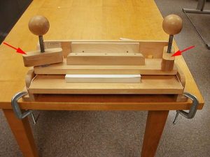 Screws tightened on the adhesive binding press
