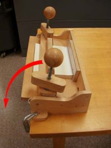 Side view of the adhesive binding press