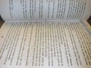 Pamphlet positioned in the binder to begin sewing