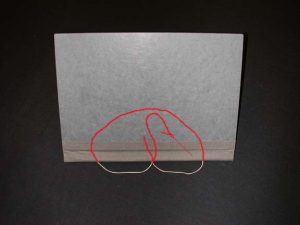 Sewing going from top hole outside to center hole outside to inside