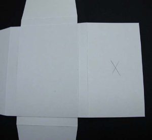 Center of the flap is marked by the crossed diagonal lines