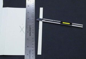 Excess of the tab flap is cut off