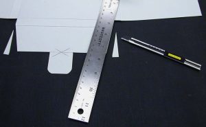 Trimming the tab flap at a slight angle