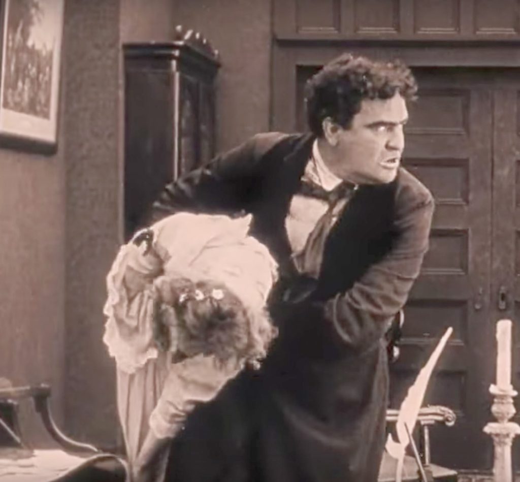 Silas Lynch accosting Elsie Stoneman in The Birth of a Nation (screen capture by author).